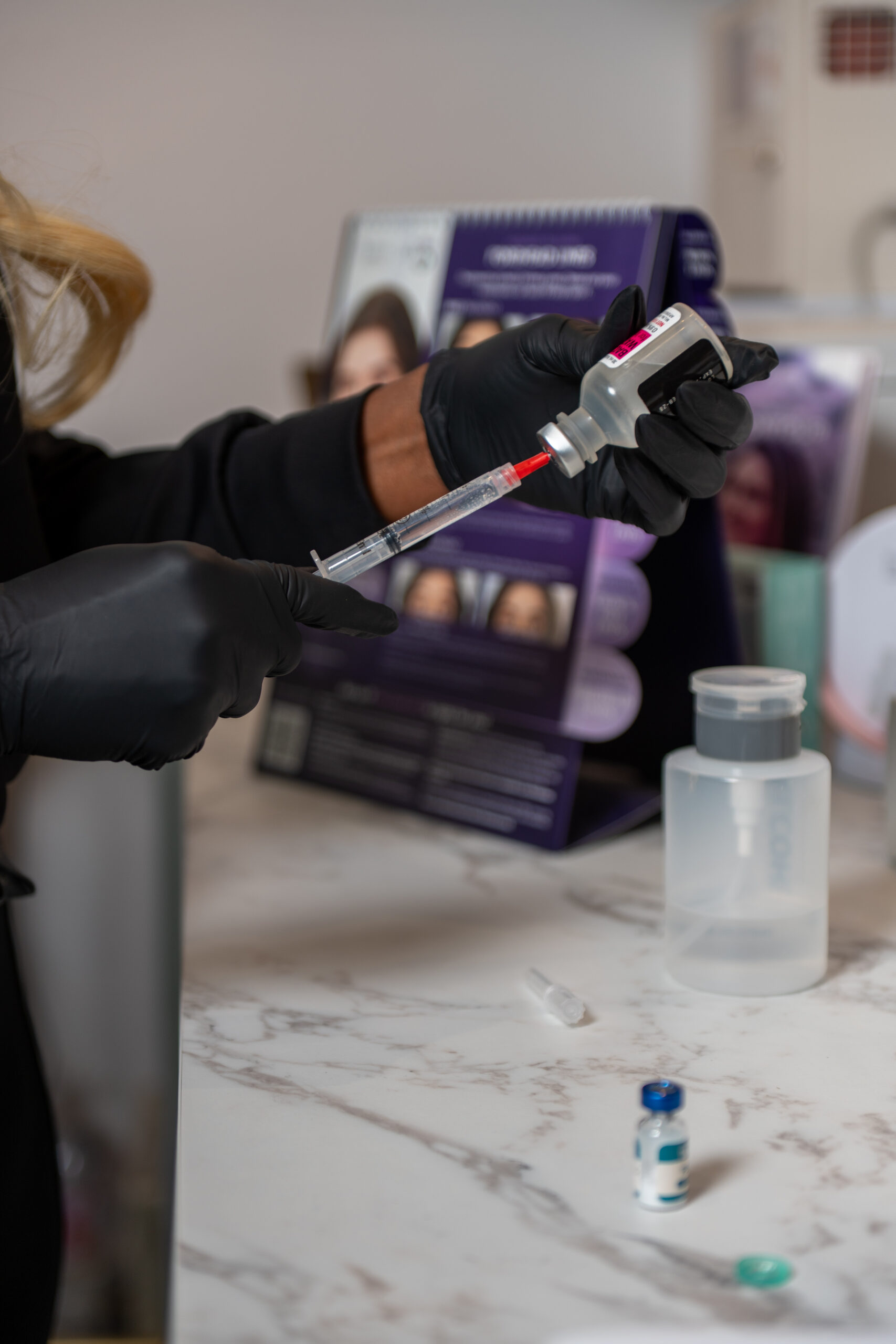 Preparing an aesthetic injectable syringe at Monroe Aesthetics