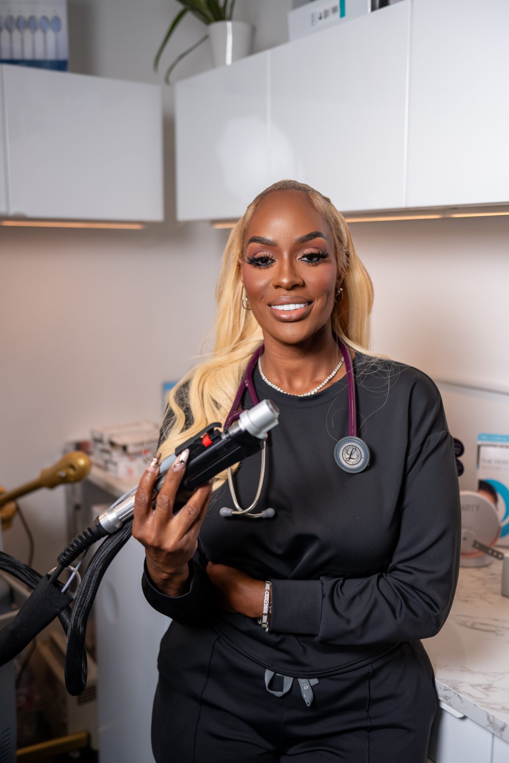 Aesthetic provider holding a laser handpiece at Monroe Aesthetics